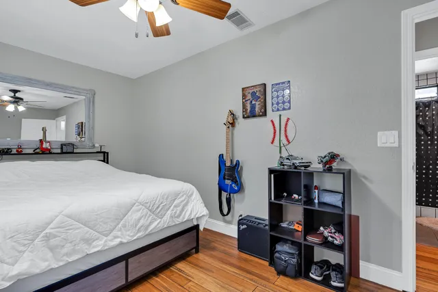 a view of a patio with table and chairs and wooden floor
