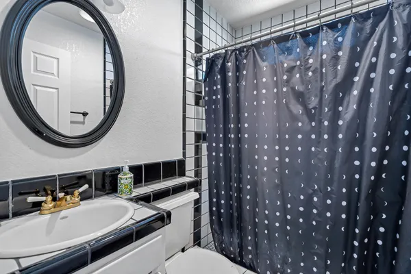 a backyard of a house with table and chairs