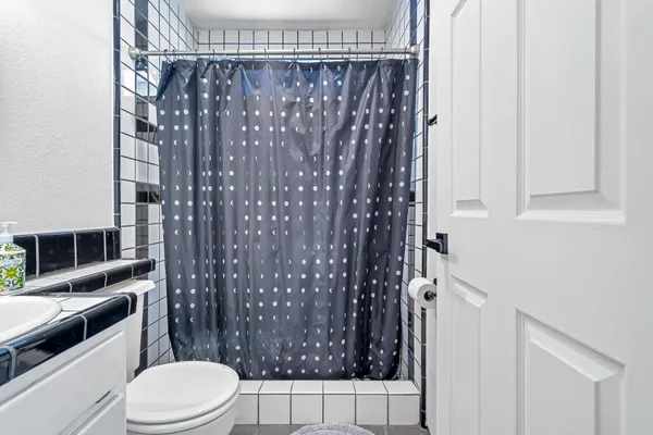 a view of a patio with table and chairs and wooden floor