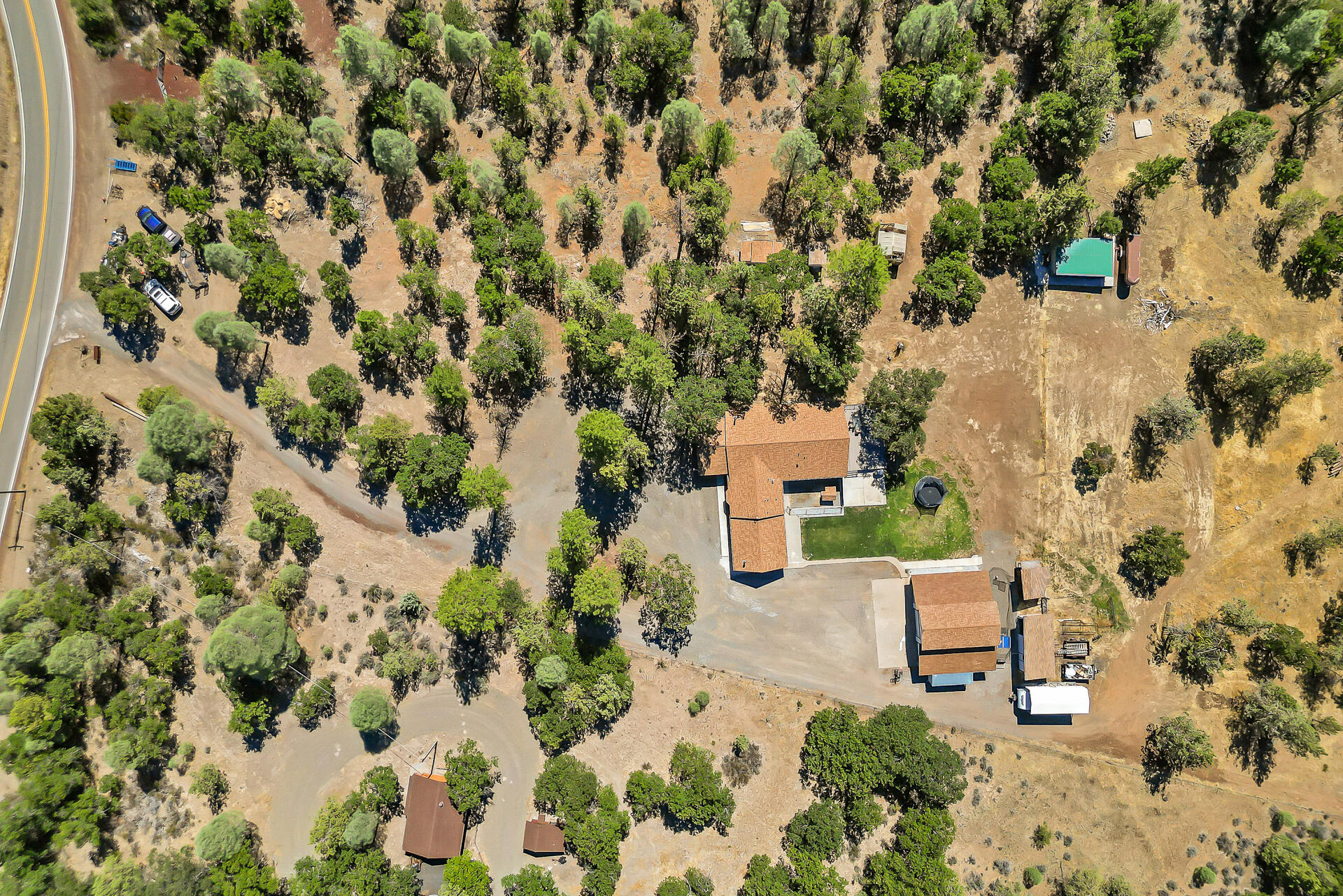 23570 Cassel Fall River Road Fall River Mills, CA 96028 - Photo 4 of 73 an aerial view of a house with a yard and sitting area