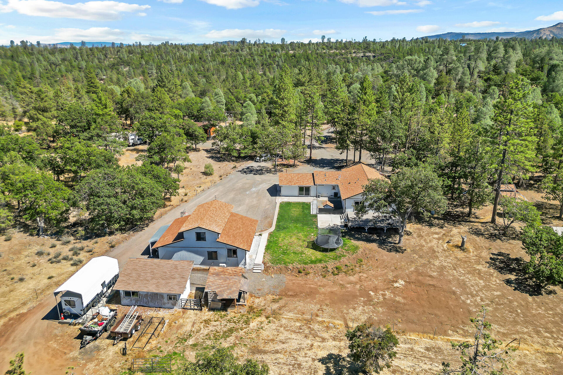 23570 Cassel Fall River Road Fall River Mills, CA 96028 - Photo 5 of 73 an aerial view of a house with a yard