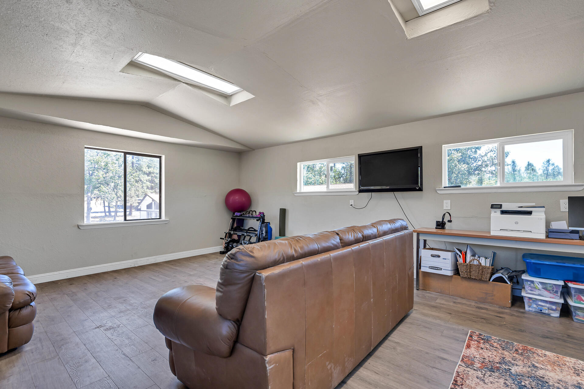 23570 Cassel Fall River Road Fall River Mills, CA 96028 - Photo 57 of 73 a living room with furniture and a flat screen tv