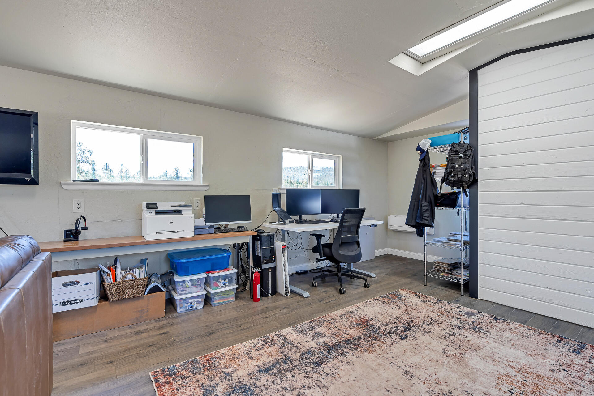 23570 Cassel Fall River Road Fall River Mills, CA 96028 - Photo 61 of 73 a view of a workspace with furniture and a window