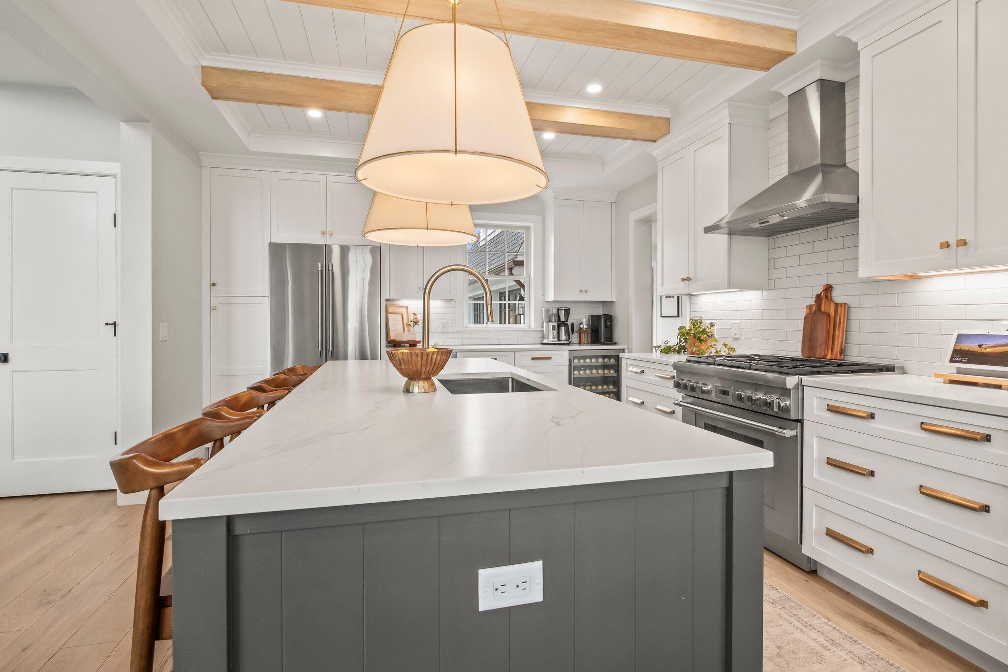 10 Rockhill Road Sandwich, MA 02563 - Photo 13 of 52 a kitchen with stainless steel appliances a stove a chimney a sink and cabinets