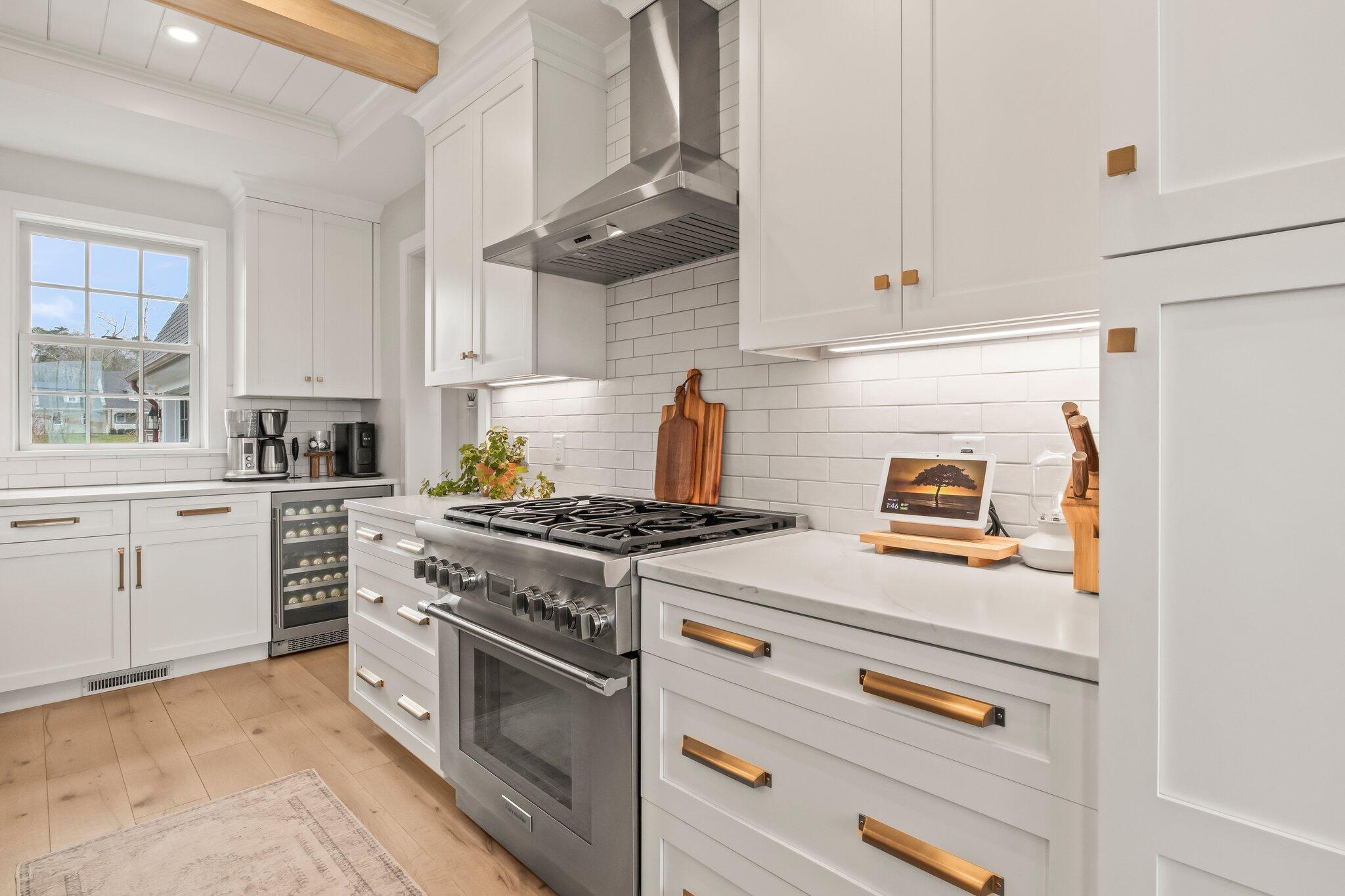 10 Rockhill Road Sandwich, MA 02563 - Photo 14 of 52 a kitchen with white cabinets and appliances