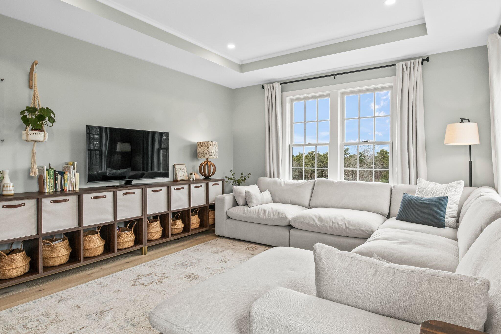 10 Rockhill Road Sandwich, MA 02563 - Photo 18 of 52 a living room with furniture a flat screen tv and a window