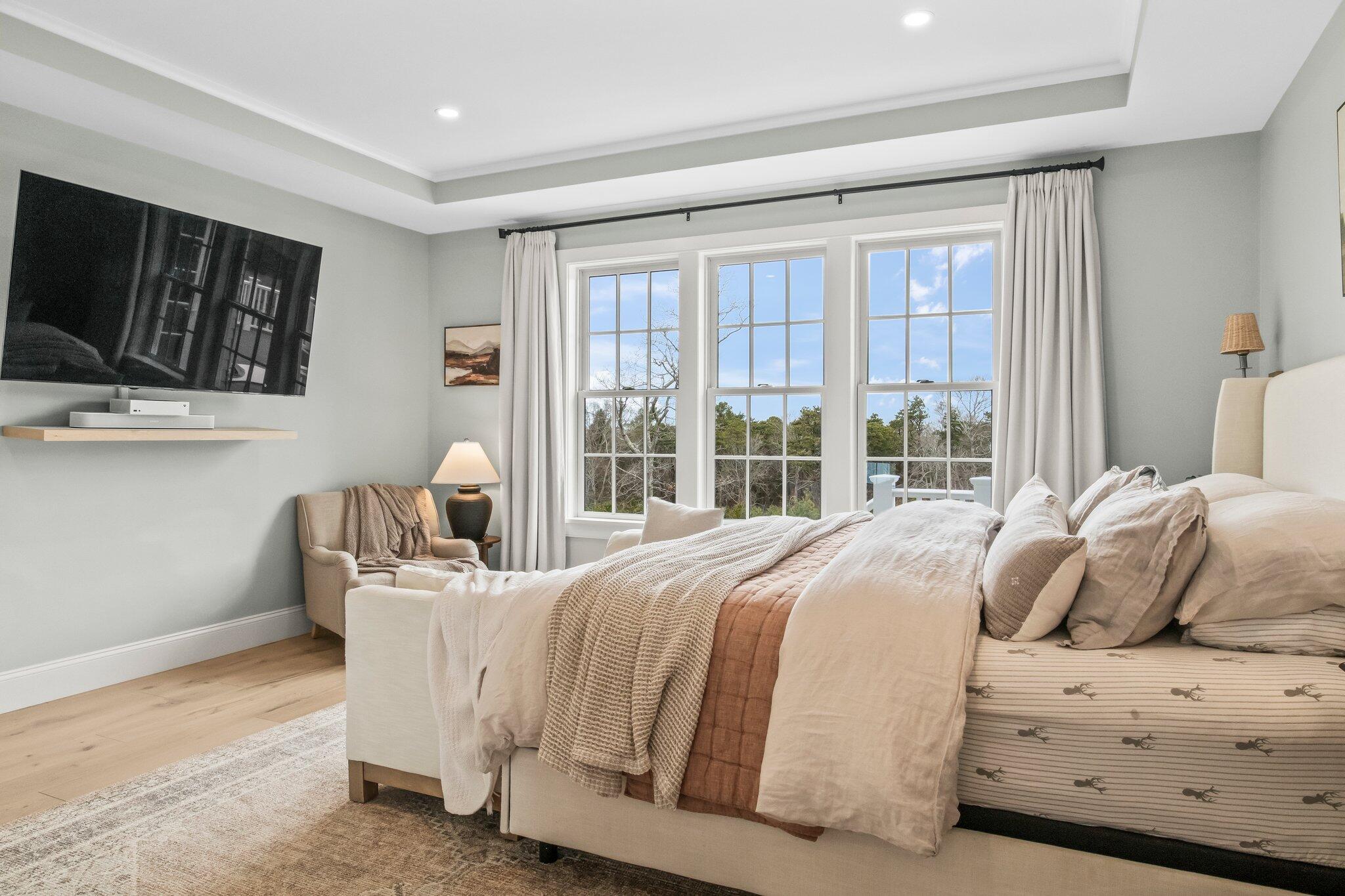 10 Rockhill Road Sandwich, MA 02563 - Photo 22 of 52 a bedroom with a bed a flat screen tv and balcony