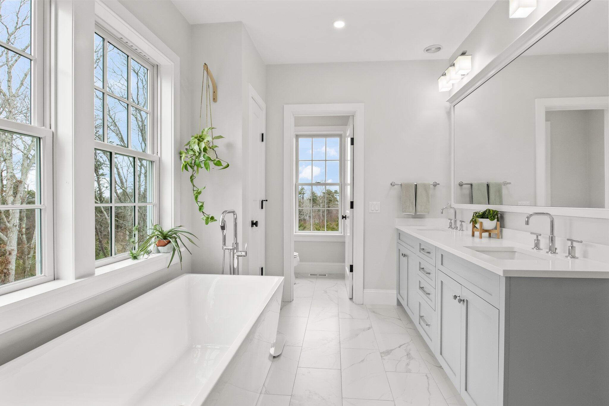 10 Rockhill Road Sandwich, MA 02563 - Photo 24 of 52 a spacious bathroom with a tub sink and mirror