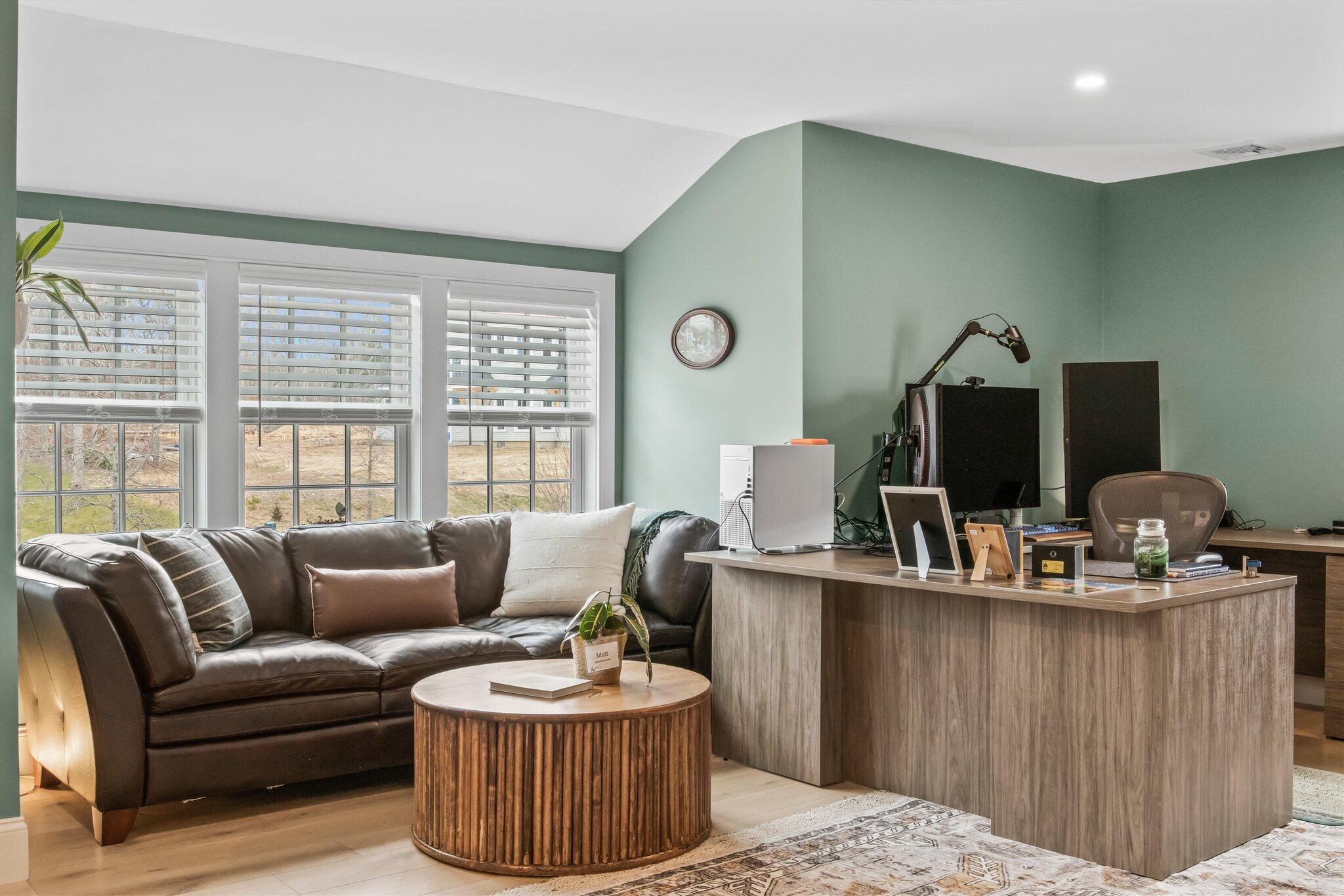 10 Rockhill Road Sandwich, MA 02563 - Photo 26 of 52 a living room with furniture a flat screen tv and a large window