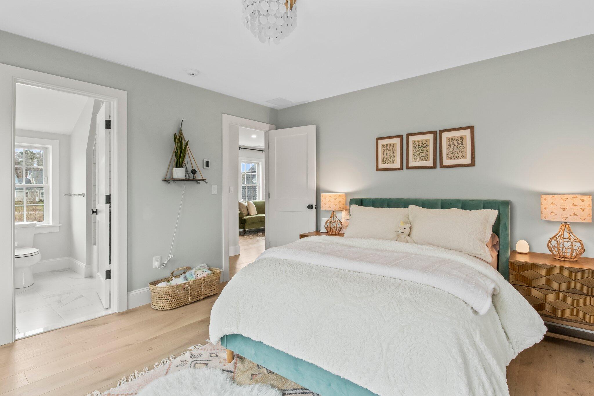 10 Rockhill Road Sandwich, MA 02563 - Photo 37 of 52 a spacious bedroom with a bed and wooden floor