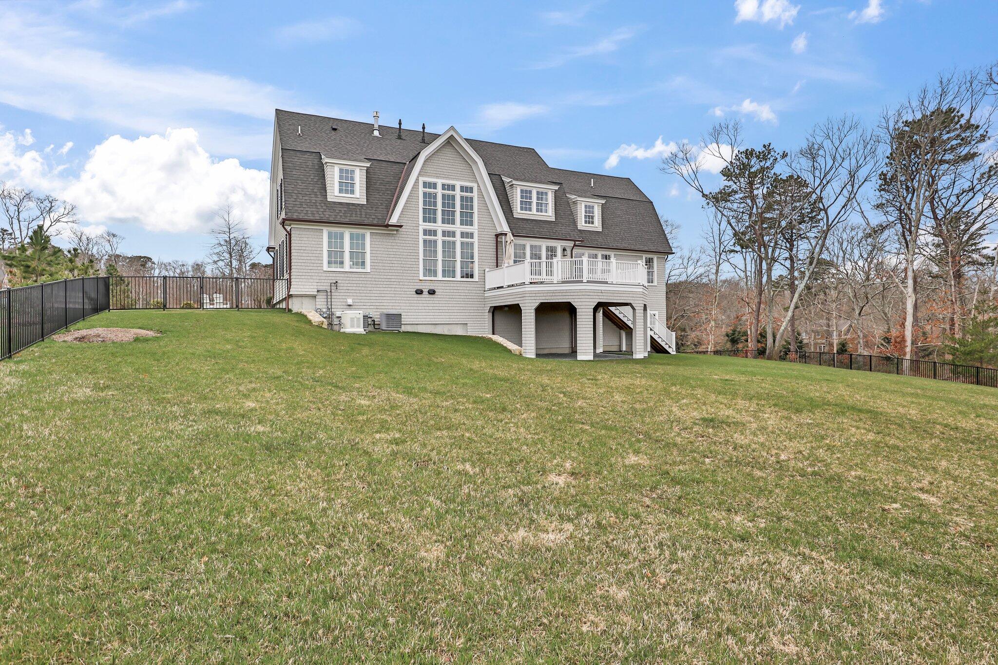 10 Rockhill Road Sandwich, MA 02563 - Photo 47 of 52 a front view of a house with a yard
