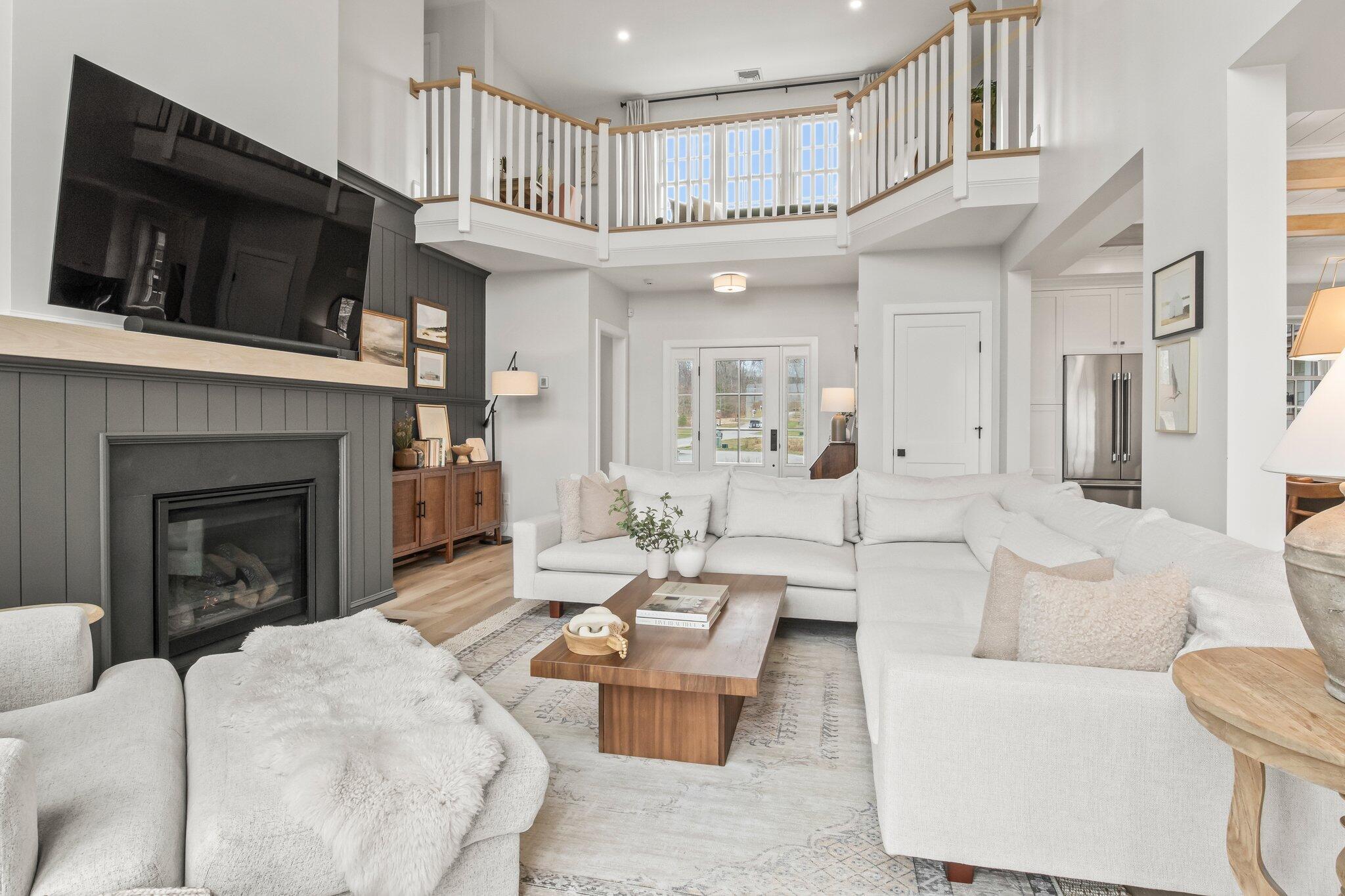 10 Rockhill Road Sandwich, MA 02563 - Photo 7 of 52 a living room with furniture a flat screen tv and a fireplace