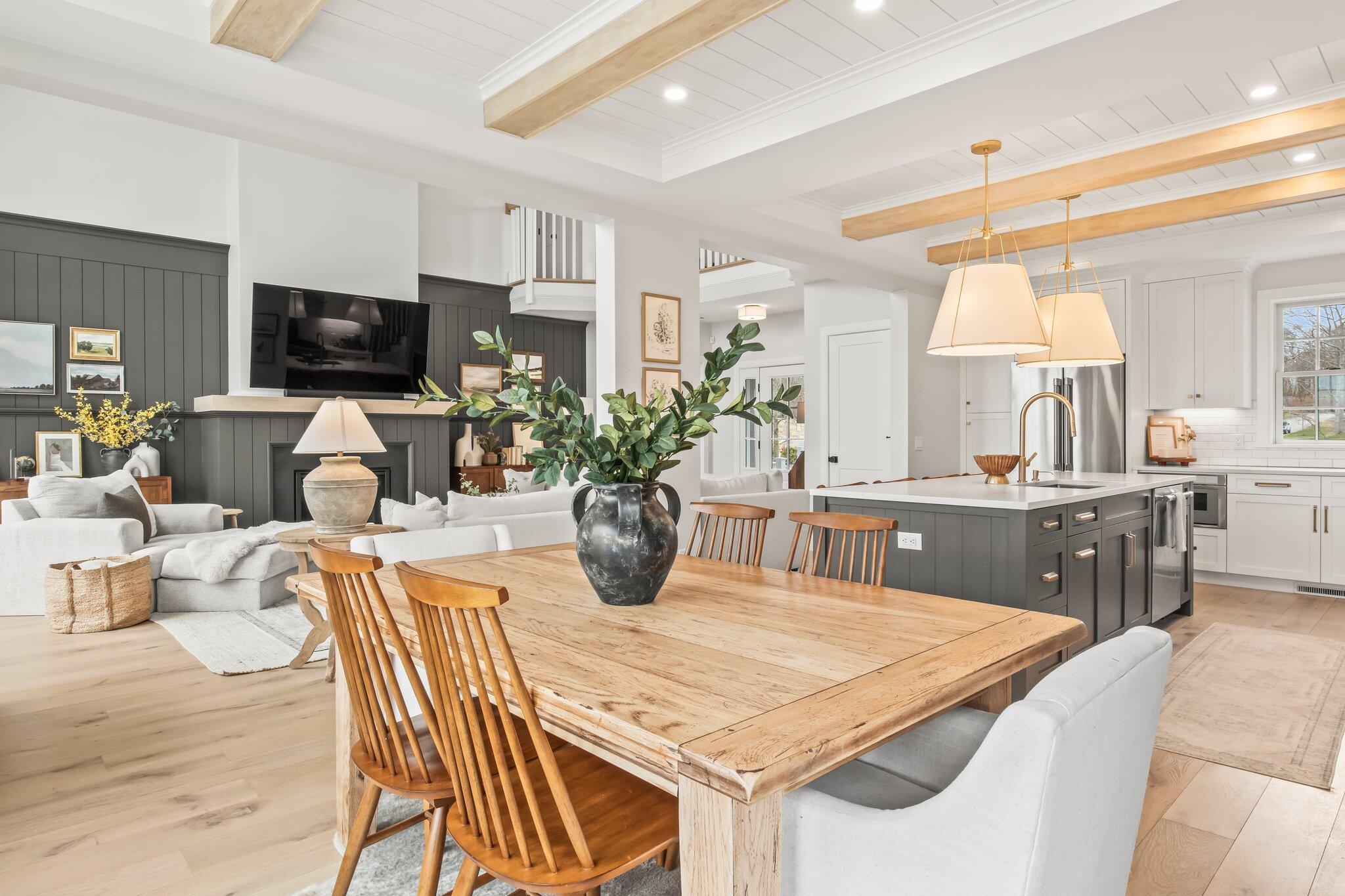 10 Rockhill Road Sandwich, MA 02563 - Photo 10 of 52 a dining room with furniture a flat screen tv and a fireplace