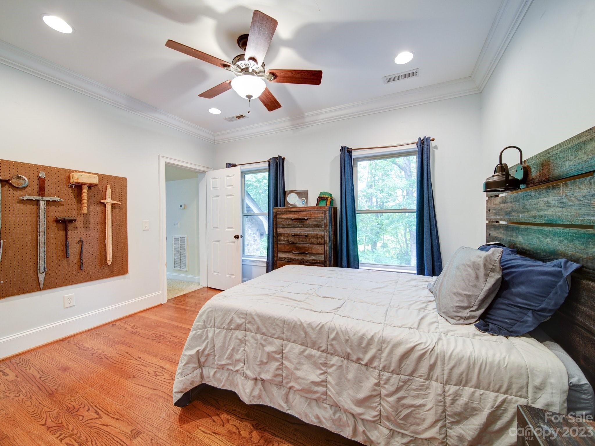 622 West Sandy Ridge Road Monroe, NC 28112 - Photo 31 of 45 a bedroom with a large bed and a window
