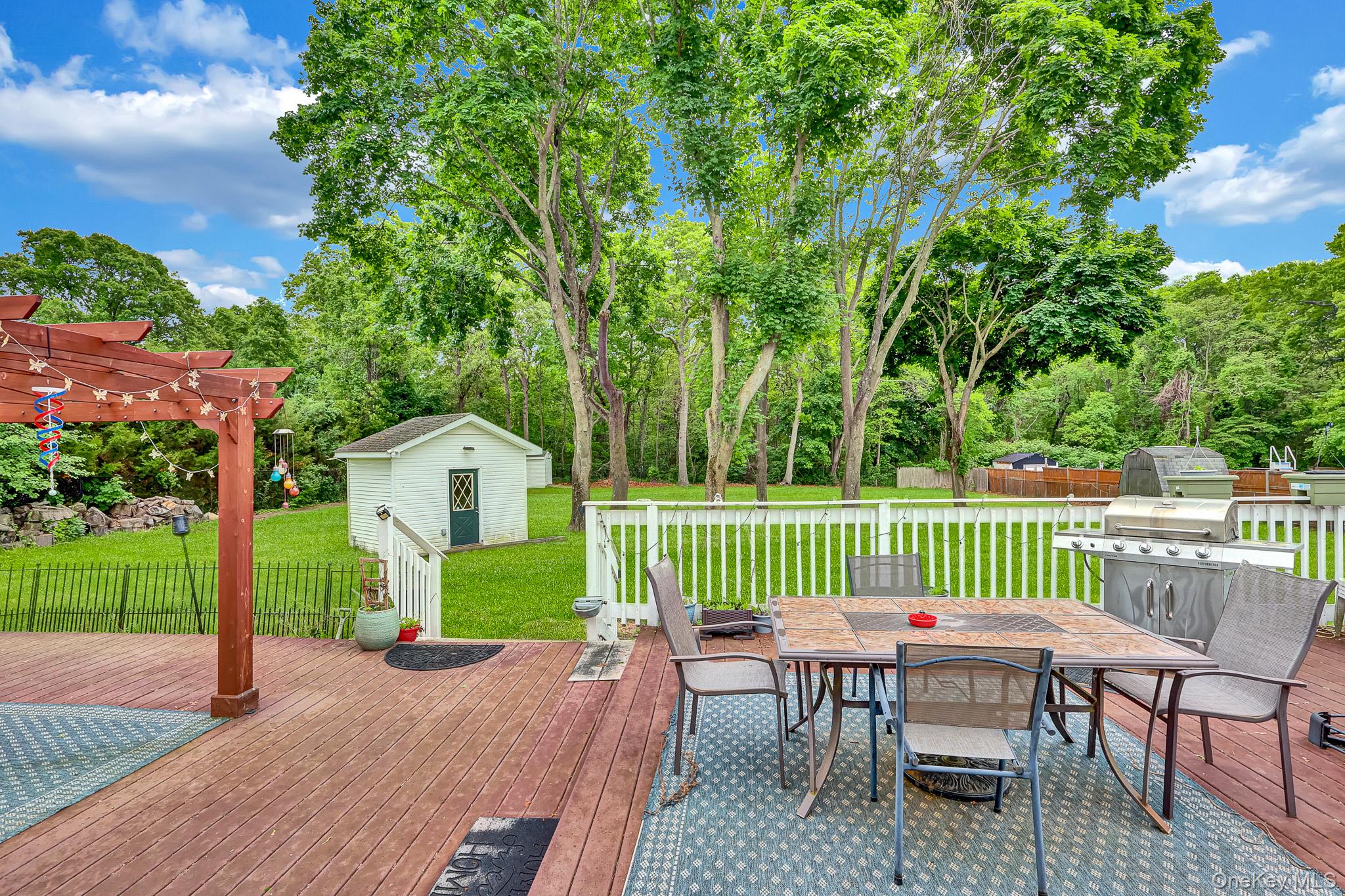 98 Granny Road Farmingville, NY 11738 - Photo 19 of 24 a view of a chairs and table in the patio
