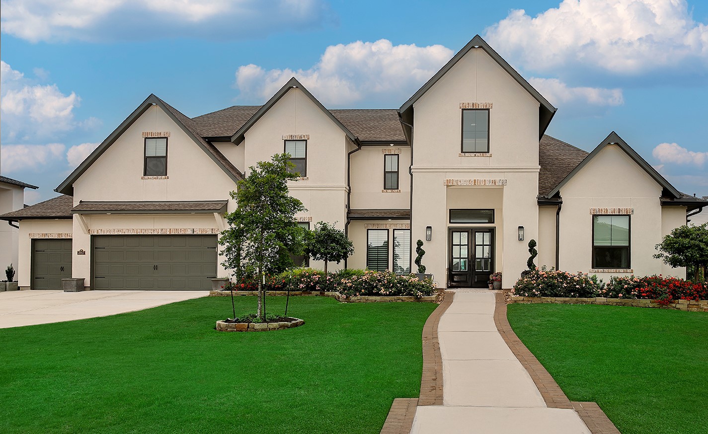 2017 Bennet Lane Conroe, TX 77384 - Photo 1 of 50 a front view of a house with a yard and potted plants