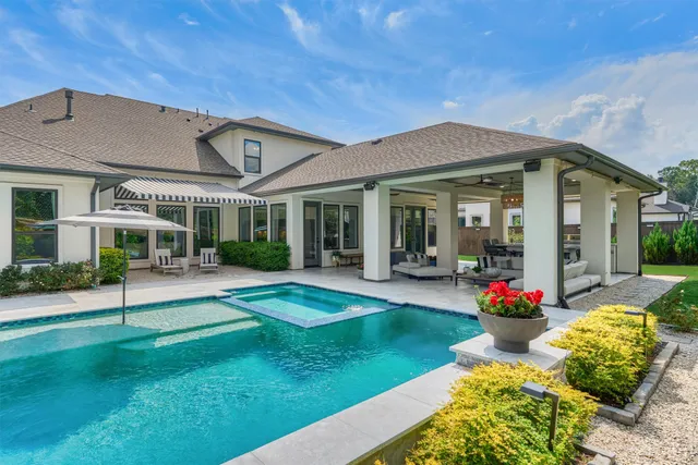 a front view of a house with a big yard