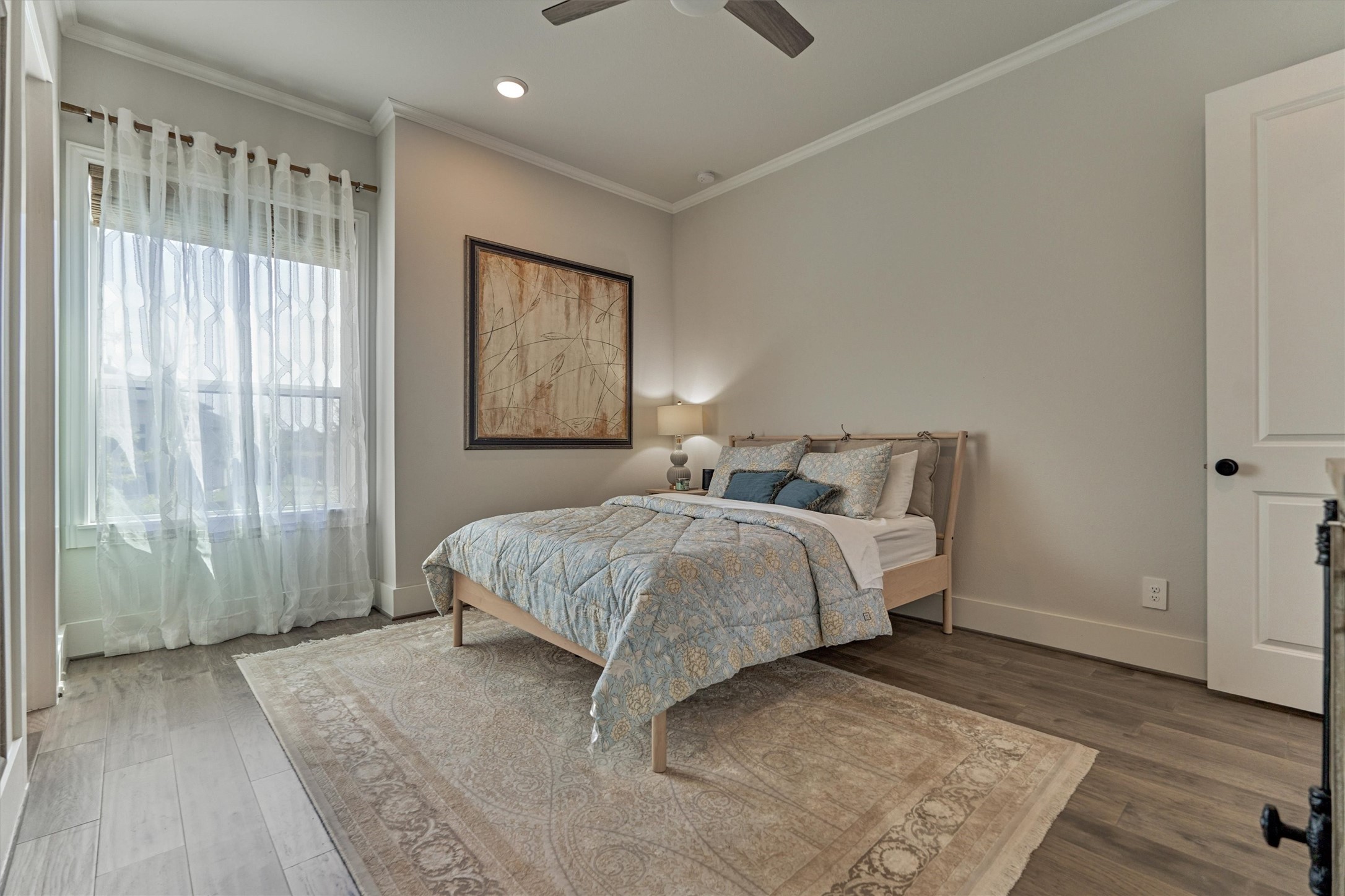 2017 Bennet Lane Conroe, TX 77384 - Photo 24 of 50 a spacious bedroom with a bed and a window
