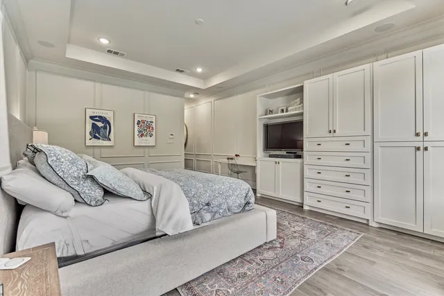 a spacious bathroom with a granite countertop sink a toilet a mirror and bathtub