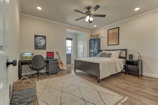 a bedroom with a bed and window