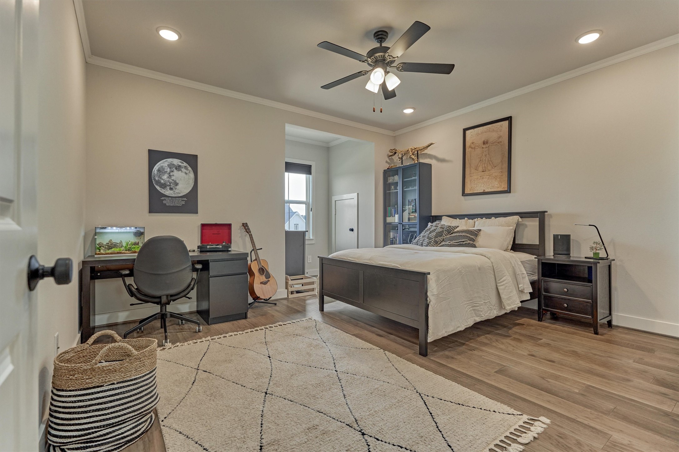 2017 Bennet Lane Conroe, TX 77384 - Photo 33 of 50 a bedroom with a bed and a chandelier