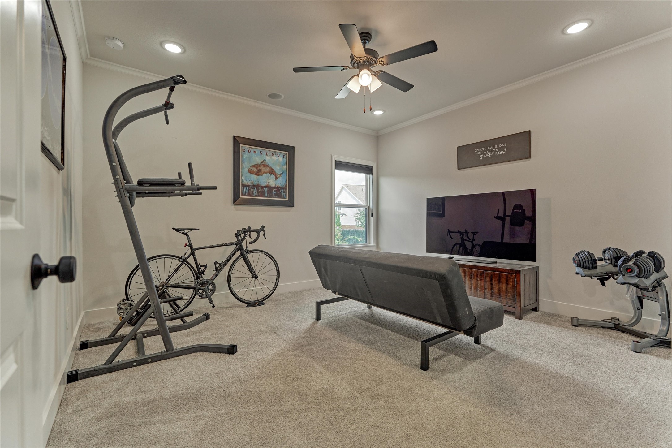 2017 Bennet Lane Conroe, TX 77384 - Photo 37 of 50 a living room with furniture and a flat screen tv