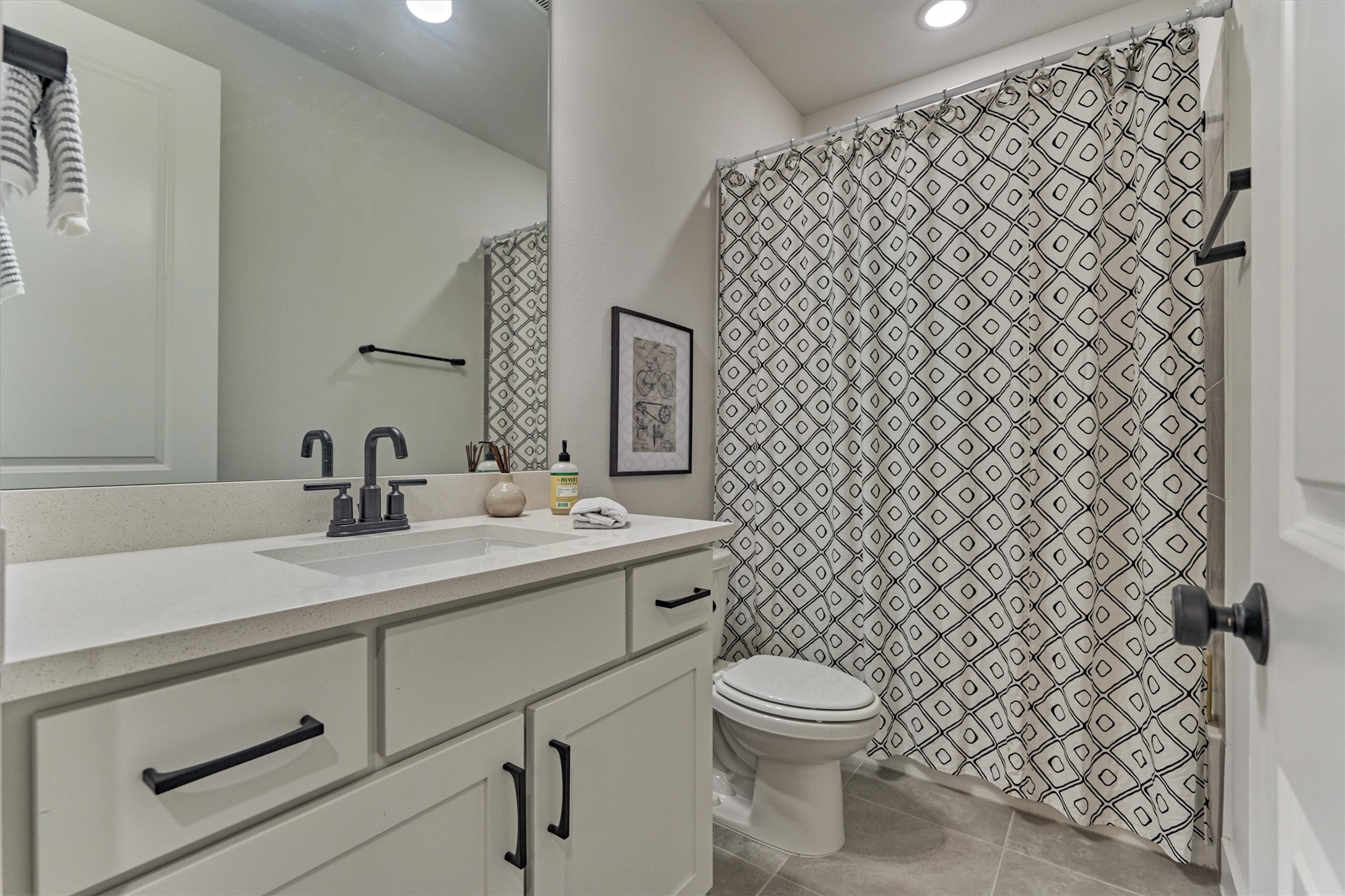 2017 Bennet Lane Conroe, TX 77384 - Photo 38 of 50 a bathroom with a sink and a toilet