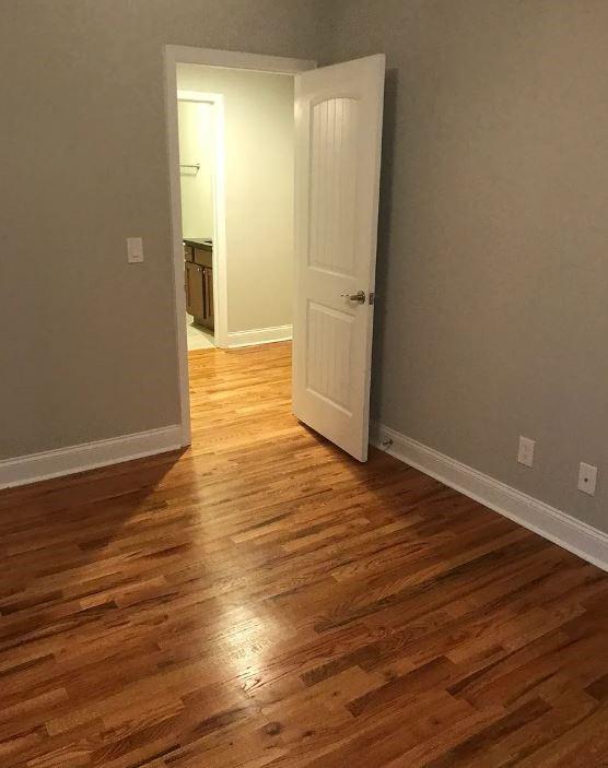 1071 Level Creek Road, Unit E3 Buford, GA 30518 - Photo 9 of 12 wooden floor in an empty room