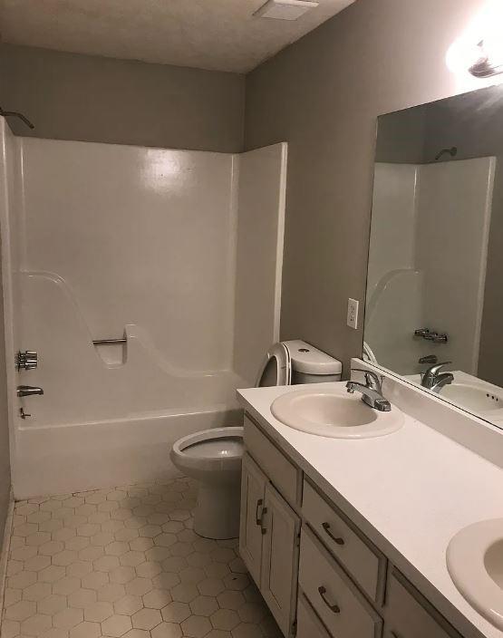 1071 Level Creek Road, Unit E3 Buford, GA 30518 - Photo 10 of 12 a bathroom with a sink a toilet and a bathtub