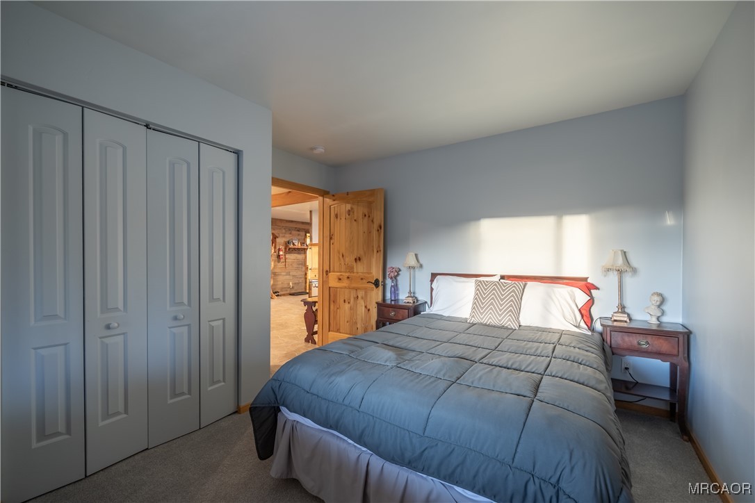 448 Edgemoor Road Big Bear Lake, CA 92315 - Photo 25 of 42 a bedroom with a bed and a closet