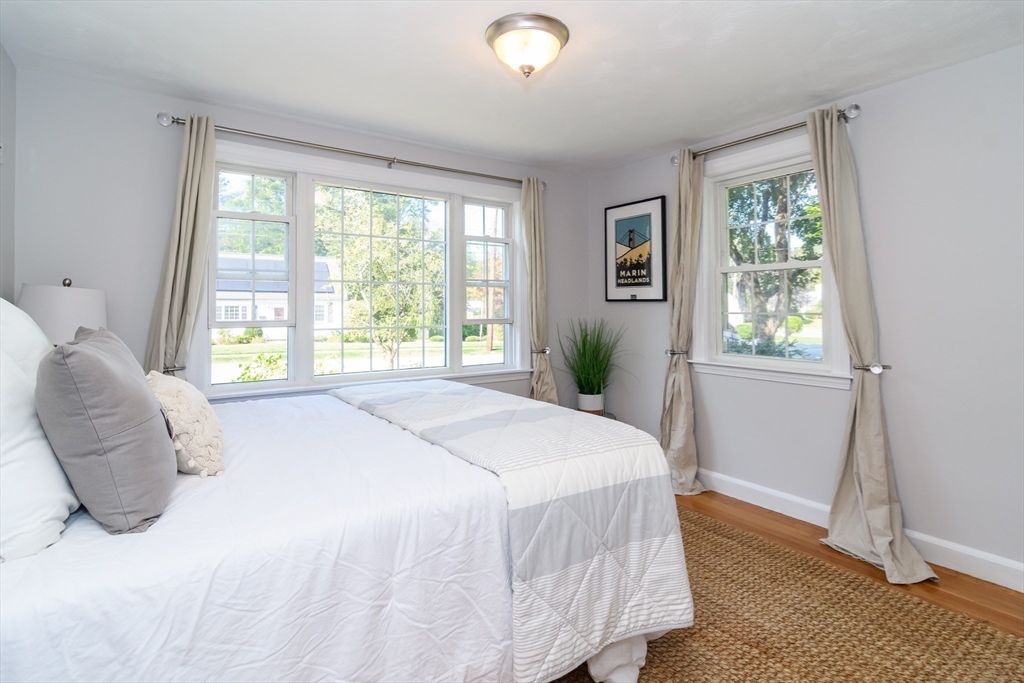 4 Pryor Road Natick, MA 01760 - Photo 11 of 24 a spacious bedroom with a bed and a window