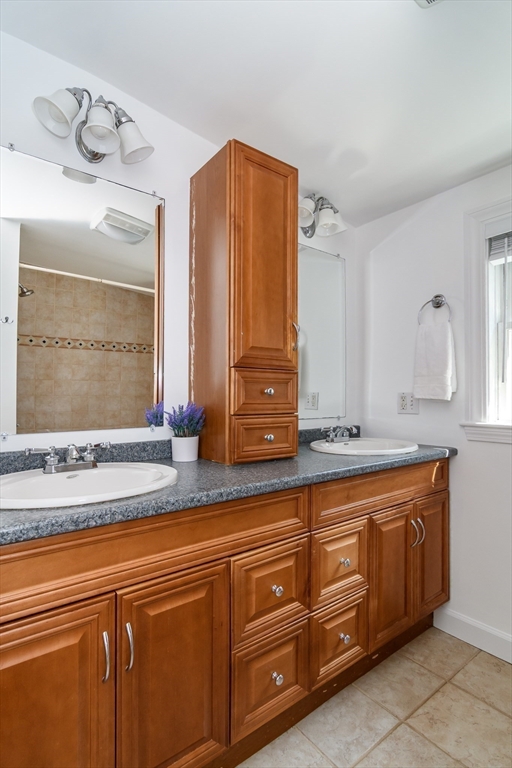 4 Pryor Road Natick, MA 01760 - Photo 15 of 24 a bathroom with a sink and a mirror