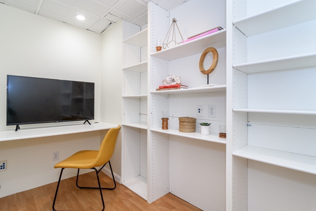 4 Pryor Road Natick, MA 01760 - Photo 16 of 24 a room with stainless steel appliances kitchen island a table and chairs in it