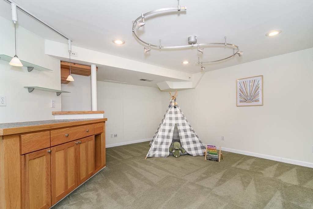 4 Pryor Road Natick, MA 01760 - Photo 18 of 24 a view of a kitchen with cabinets and wooden floor