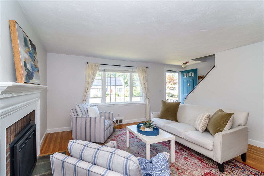 4 Pryor Road Natick, MA 01760 - Photo 2 of 24 a living room with furniture and a fireplace