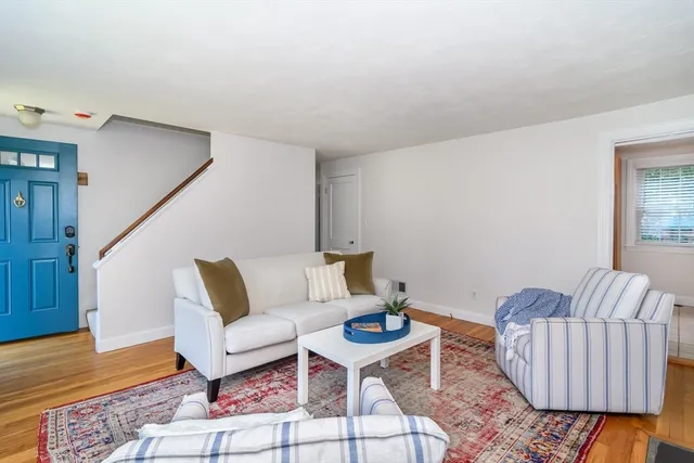 a living room with furniture and a rug