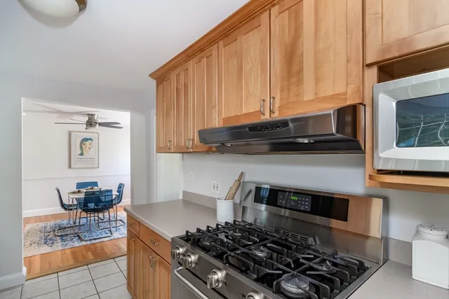 a kitchen with a stove and a microwave