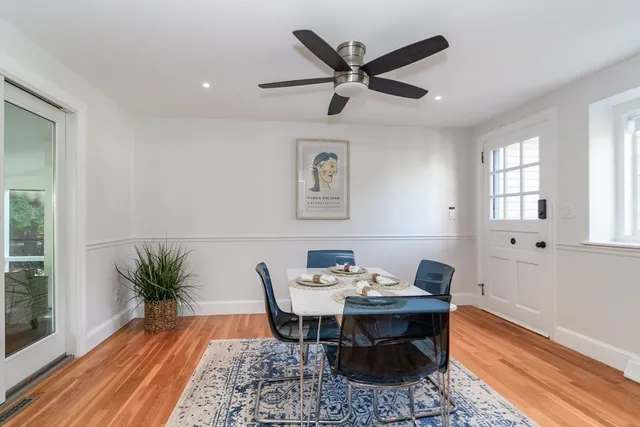 a view of a workspace with furniture and a potted plant