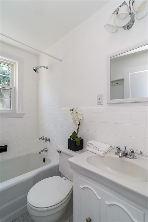 4 Pryor Road Natick, MA 01760 - Photo 10 of 24 a bathroom with a sink a toilet and shower