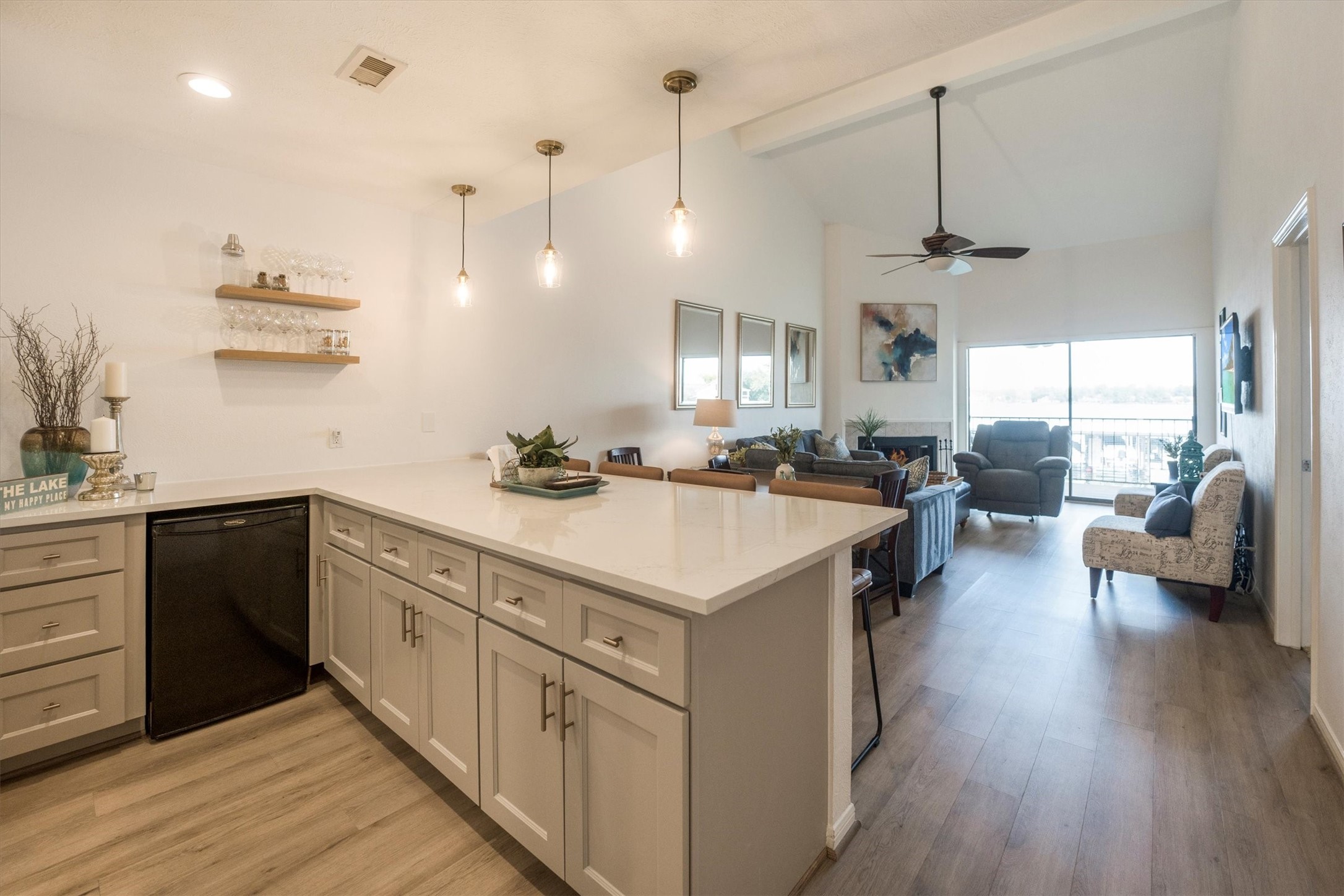 202 Lakeview Terrace, Unit A Conroe, TX 77356 - Photo 11 of 45 a kitchen with counter top space and wooden floor