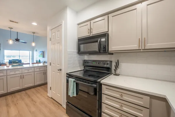 a bedroom with a large bed and a couch