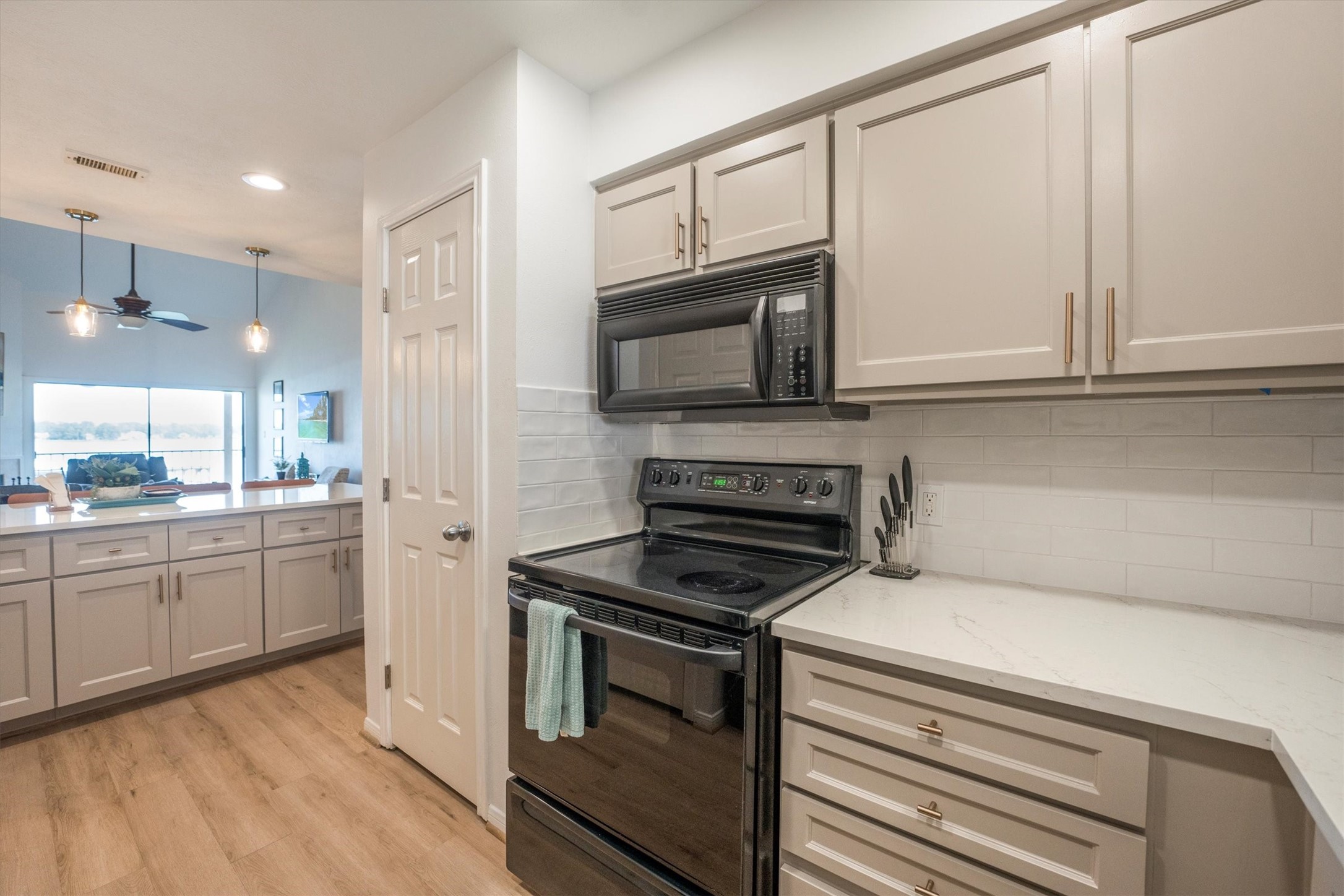 202 Lakeview Terrace, Unit A Conroe, TX 77356 - Photo 16 of 45 a kitchen with cabinets stainless steel appliances and a counter space