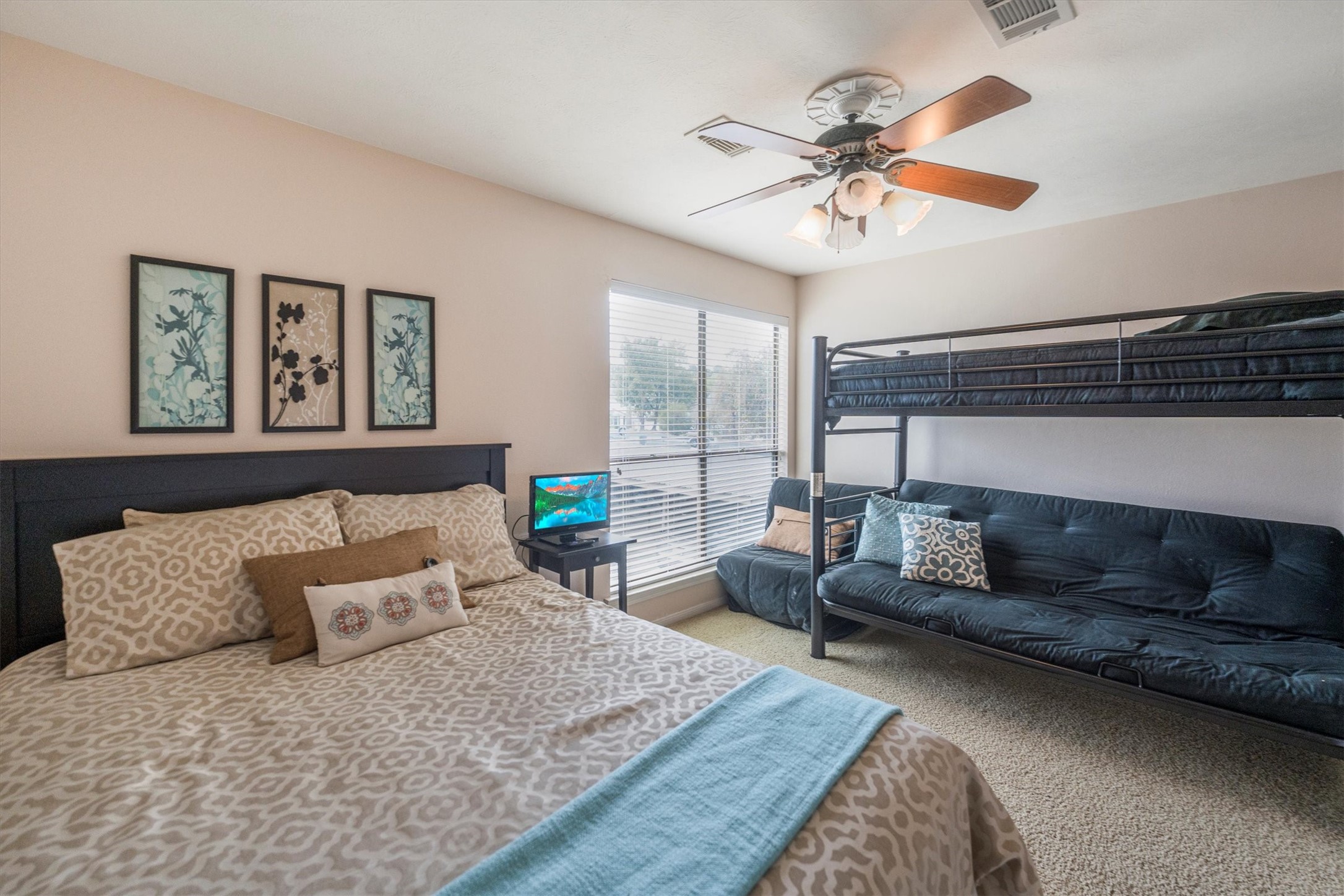 202 Lakeview Terrace, Unit A Conroe, TX 77356 - Photo 19 of 45 a living room with furniture and a large window