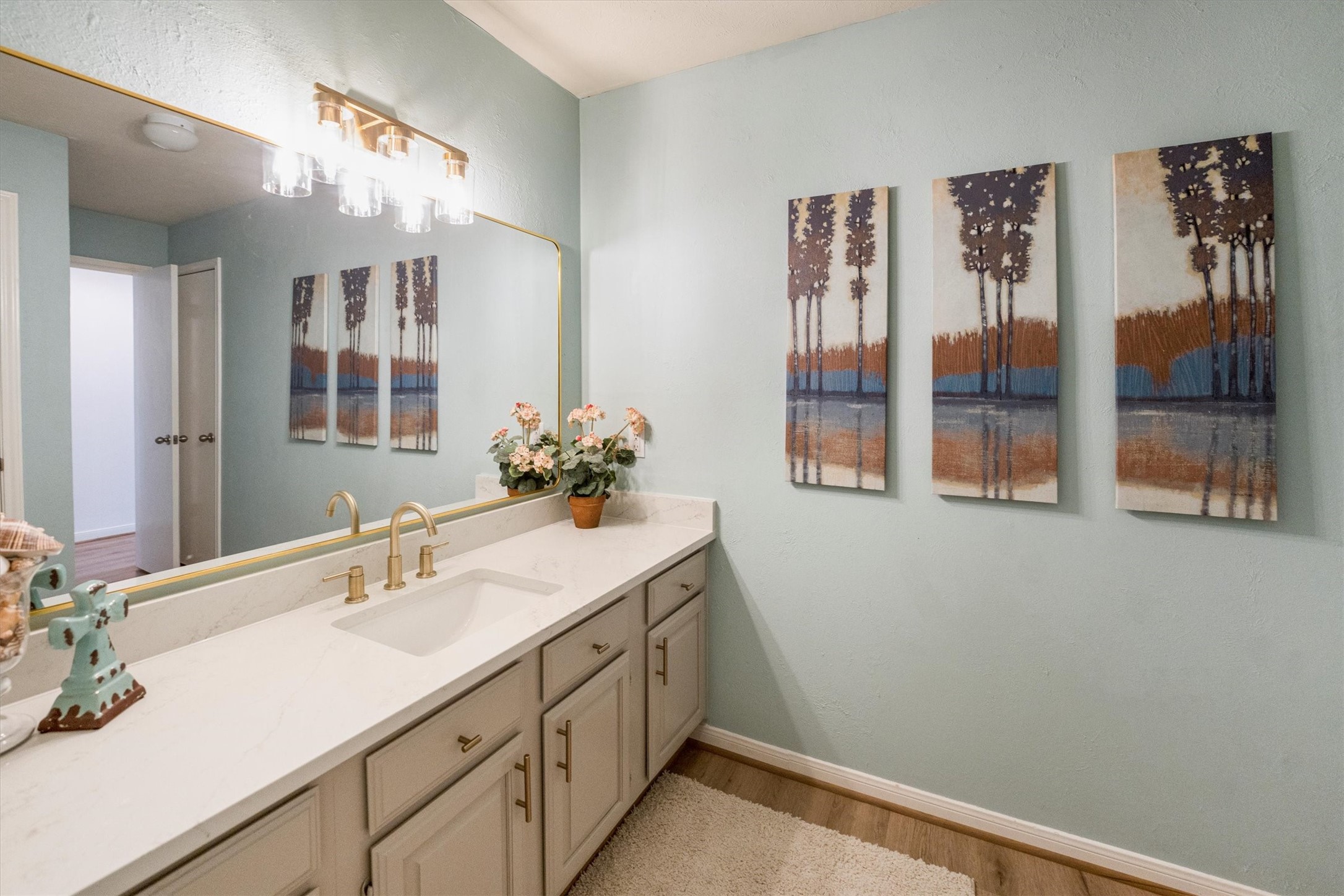 202 Lakeview Terrace, Unit A Conroe, TX 77356 - Photo 21 of 45 a bathroom with a sink and a mirror