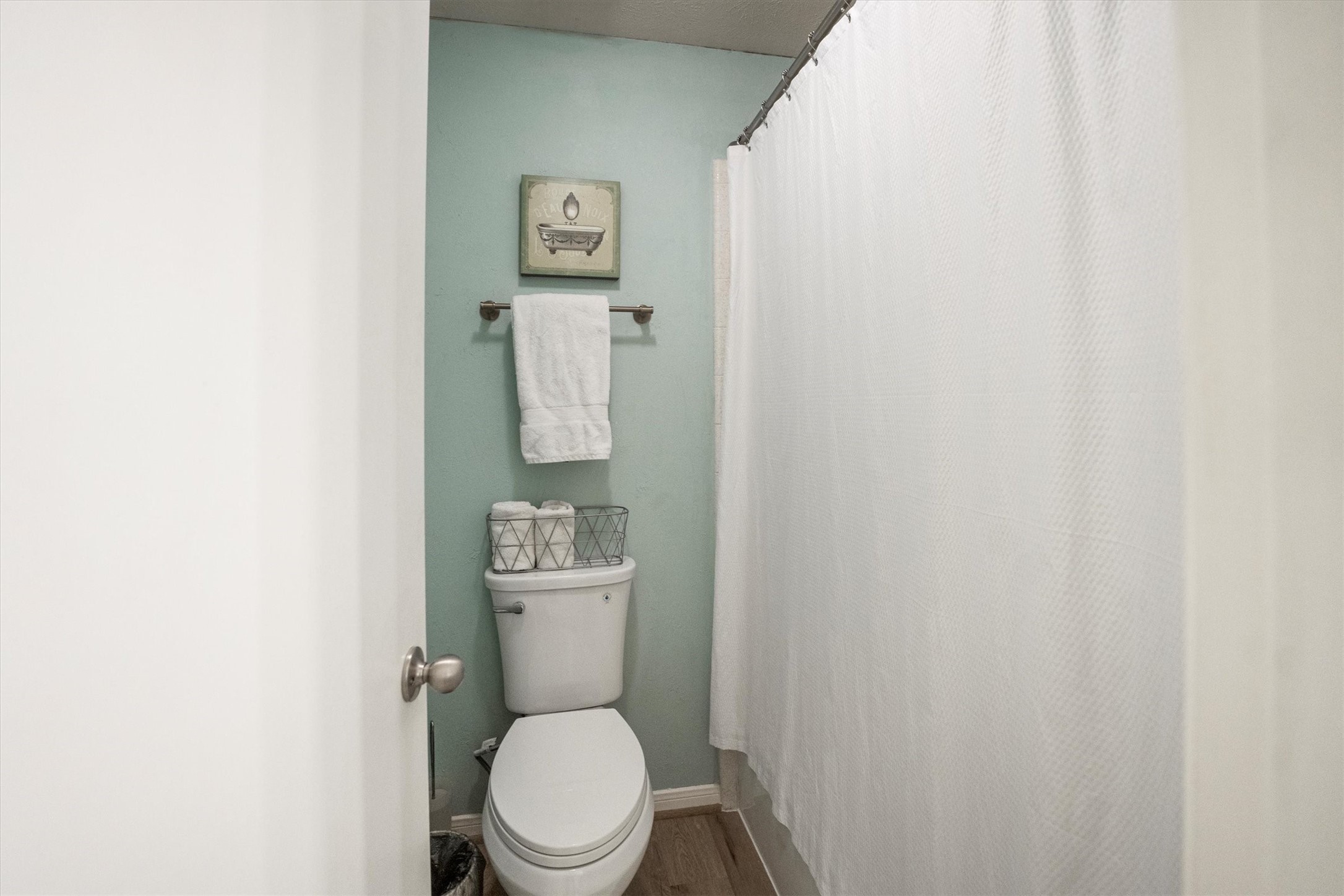 202 Lakeview Terrace, Unit A Conroe, TX 77356 - Photo 23 of 45 a white toilet sitting next to a white sink