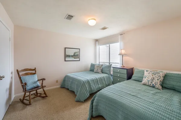 a bedroom with a bed and a cabinets