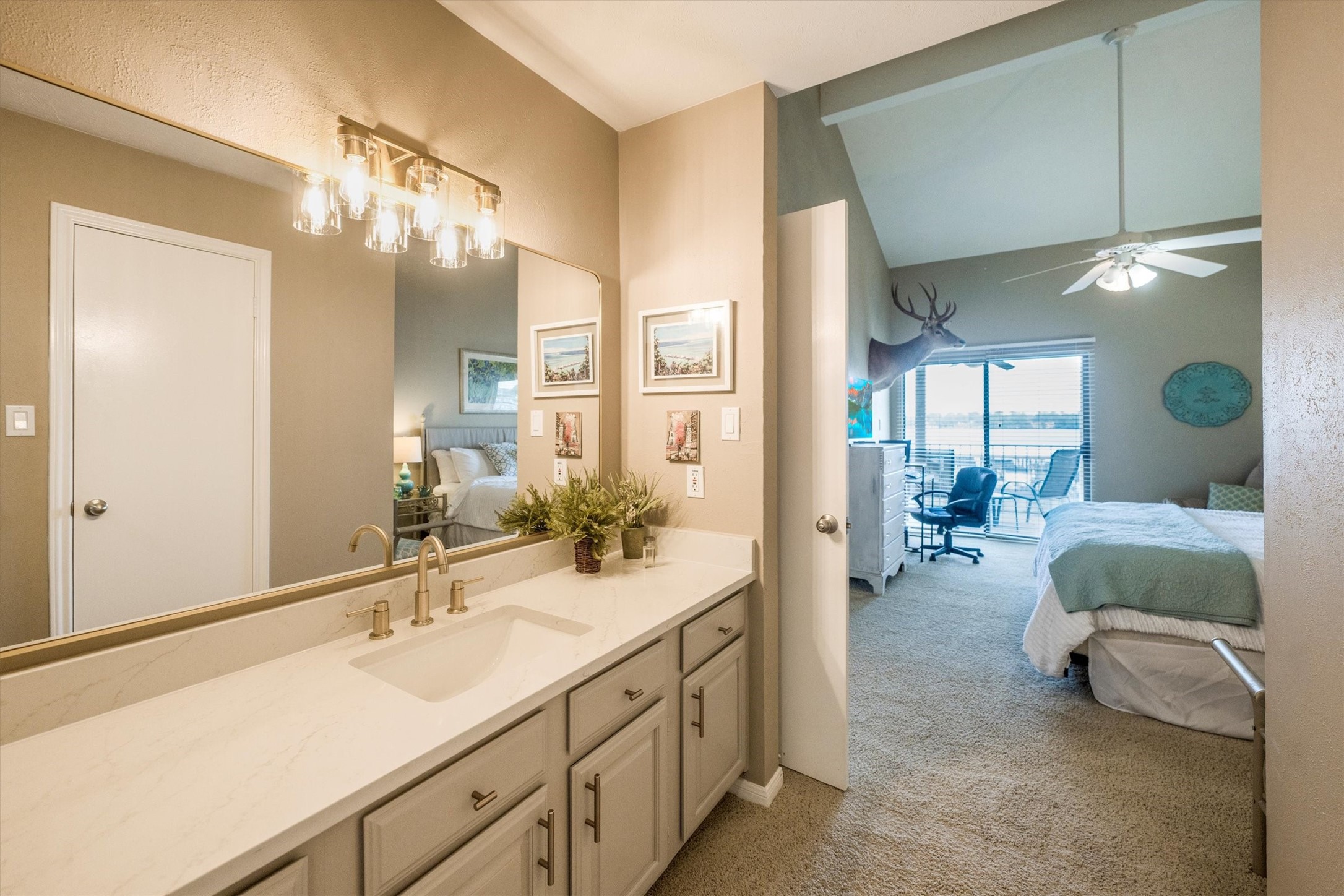 202 Lakeview Terrace, Unit A Conroe, TX 77356 - Photo 30 of 45 a spacious en suite bathroom with a double vanity sink and mirror