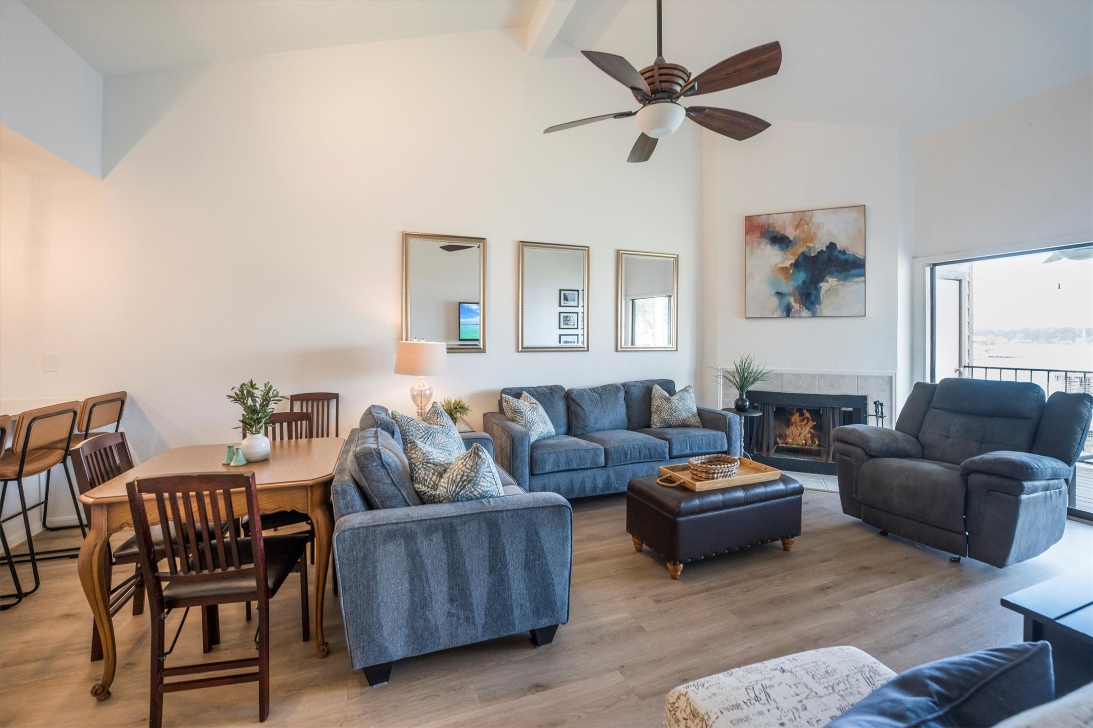 202 Lakeview Terrace, Unit A Conroe, TX 77356 - Photo 3 of 45 a living room with furniture a fireplace and a window