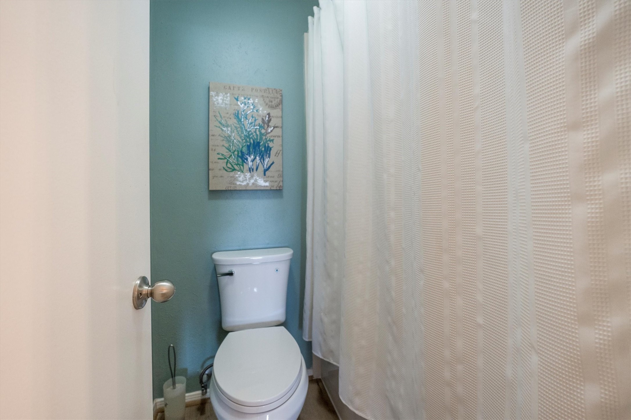202 Lakeview Terrace, Unit A Conroe, TX 77356 - Photo 31 of 45 a white toilet sitting next to a white wall