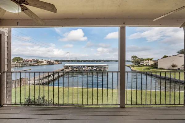a view of a balcony with wooden floor